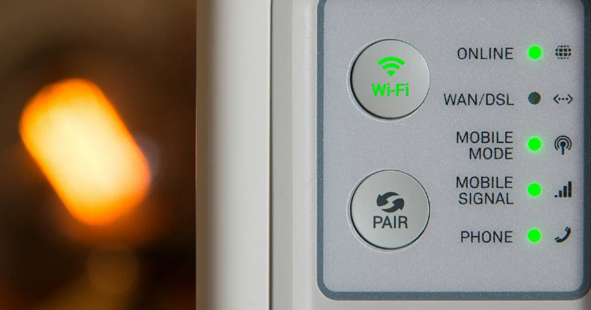 Close-up of a white router's status lights